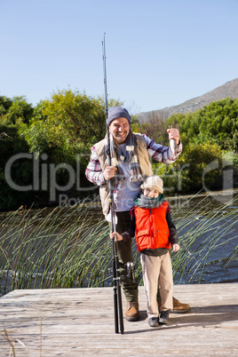 Happy man fishing with his son