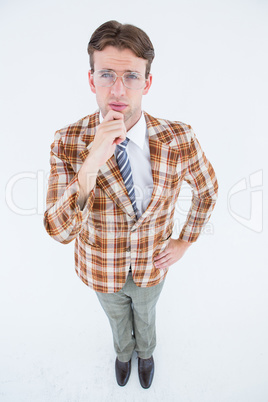 Geeky hipster thinking with hand on chin