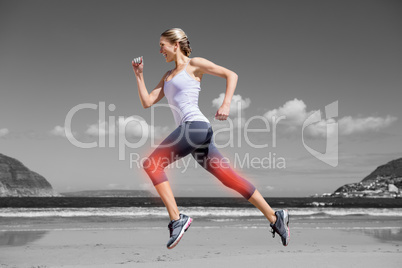 Highlighted leg of jogging woman on beach