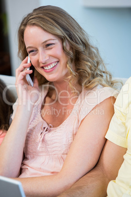 Happy mother on the phone