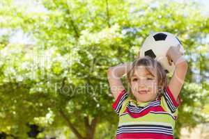 Happy little boy holding football