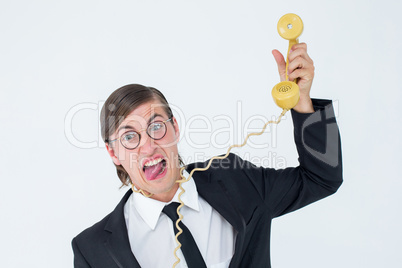 Geeky businessman being strangled by phone cord