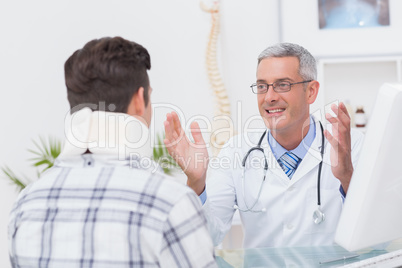 Doctor talking to patient wearing neck brace