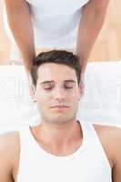 Man receiving neck massage