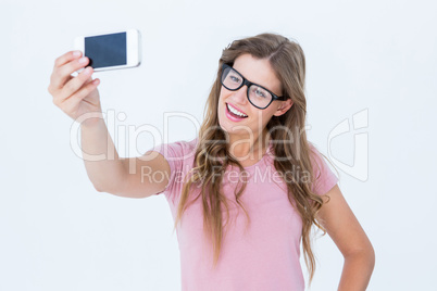 Pretty blonde taking a selfie of herself