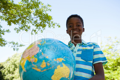 Cute little boy with globe