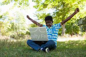 Cute little boy with laptop