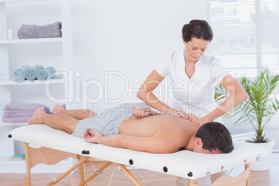 Physiotherapist doing back massage