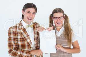 Geeky hipsters holding a poster