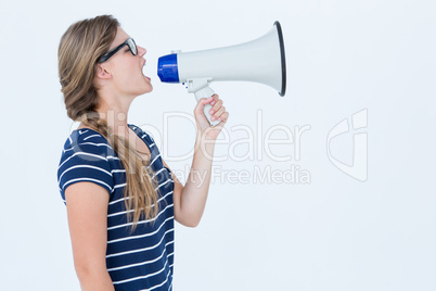 Woman shouting through a loudspeaker