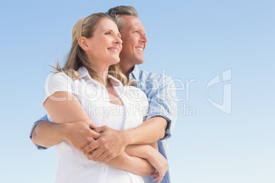 Happy couple standing and hugging