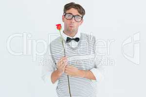 Geeky hipster holding a red rose