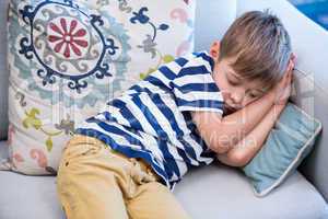 Little boy sleeping on the couch