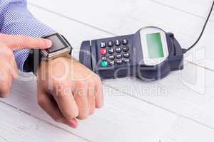 Man using smart watch to express pay