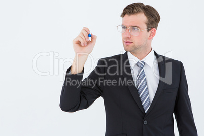 Geeky businessman writing with marker