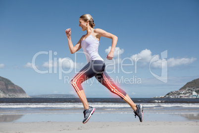 Highlighted leg bones of jogging woman on beach