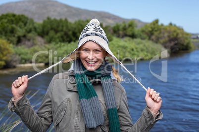 Happy casual woman at a lake