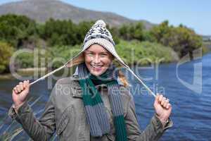 Happy casual woman at a lake