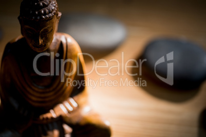 Wooden buddha statue on table