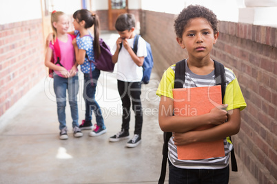 Pupils friends teasing a pupil alone