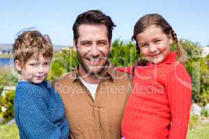 Happy family smiling at camera