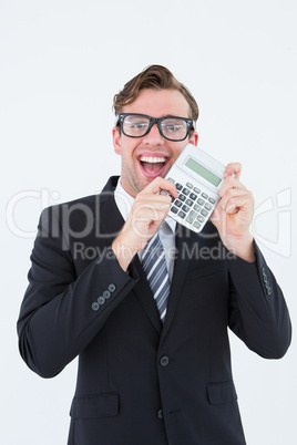 Geeky businessman pointing to calculator