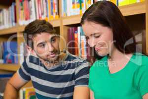 Students sitting on floor in library