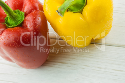 Two peppers on chopping board