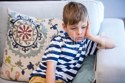 Tired little boy on the couch