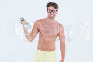 Geeky hipster posing topless with dumbbell