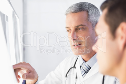 Doctor showing X rays to his patient