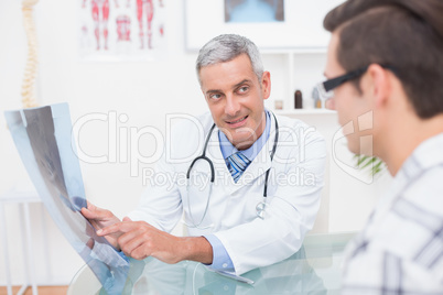 Doctor showing Xrays to his patient