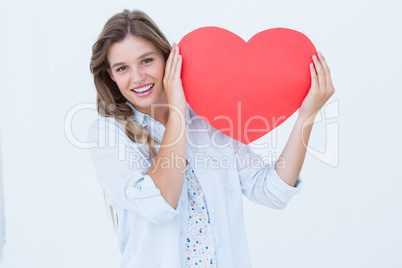 Woman holding heart card