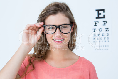 Pretty hipster with glasses and eye test