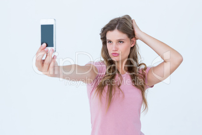Pretty blonde taking a selfie of herself Pretty blonde taking a selfie of herself