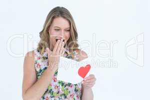 Smiling woman reading love letter