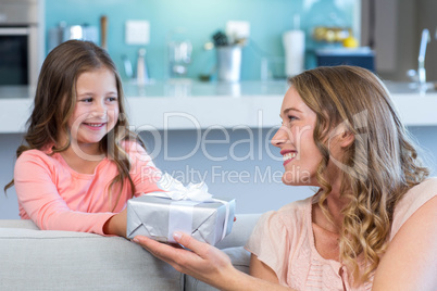 Daughter surprising mother with gift