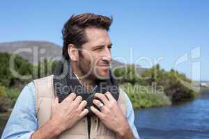 Handsome casual man at a lake