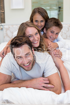 Happy family on the bed