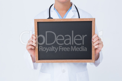 Doctor showing little blackboard