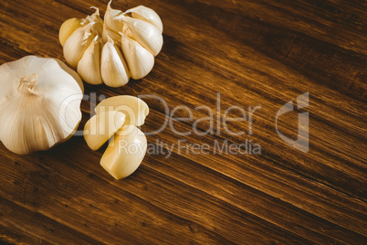 Garlic cloves and bulb on chopping board