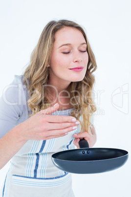 Smiling woman smelling the meal