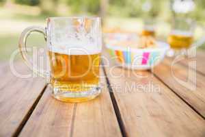 Beer and snacks on picnic table