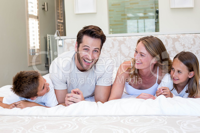 Happy family smiling at camera Happy family smiling at camera