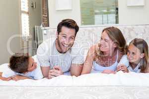 Happy family smiling at camera