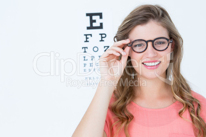Pretty geeky hipster with glasses and eye test