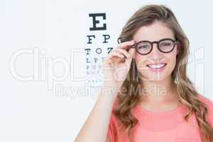 Pretty geeky hipster with glasses and eye test