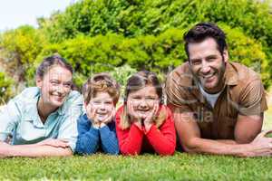 Happy family smiling at camera