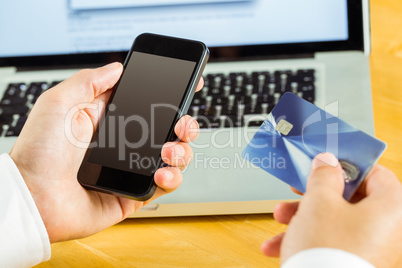 Man using smartphone for online shopping