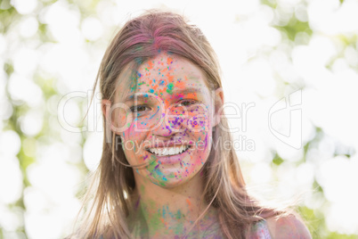 Pretty blonde covered in powder paint